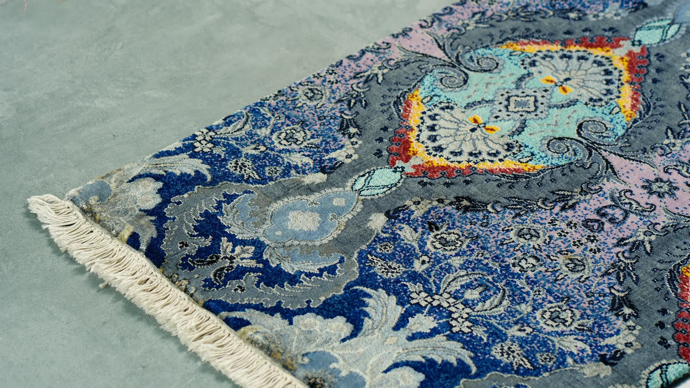 Indigo and turquoise rug with a central medallion
