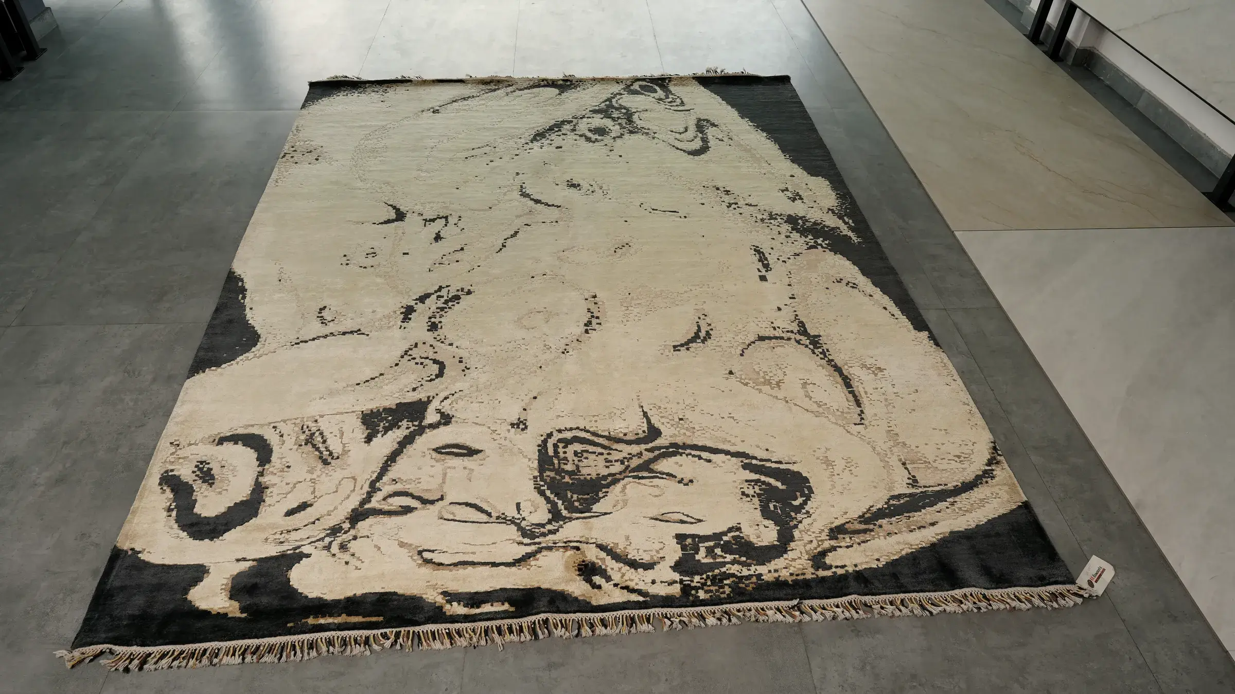Ivory rug with a black marbled design