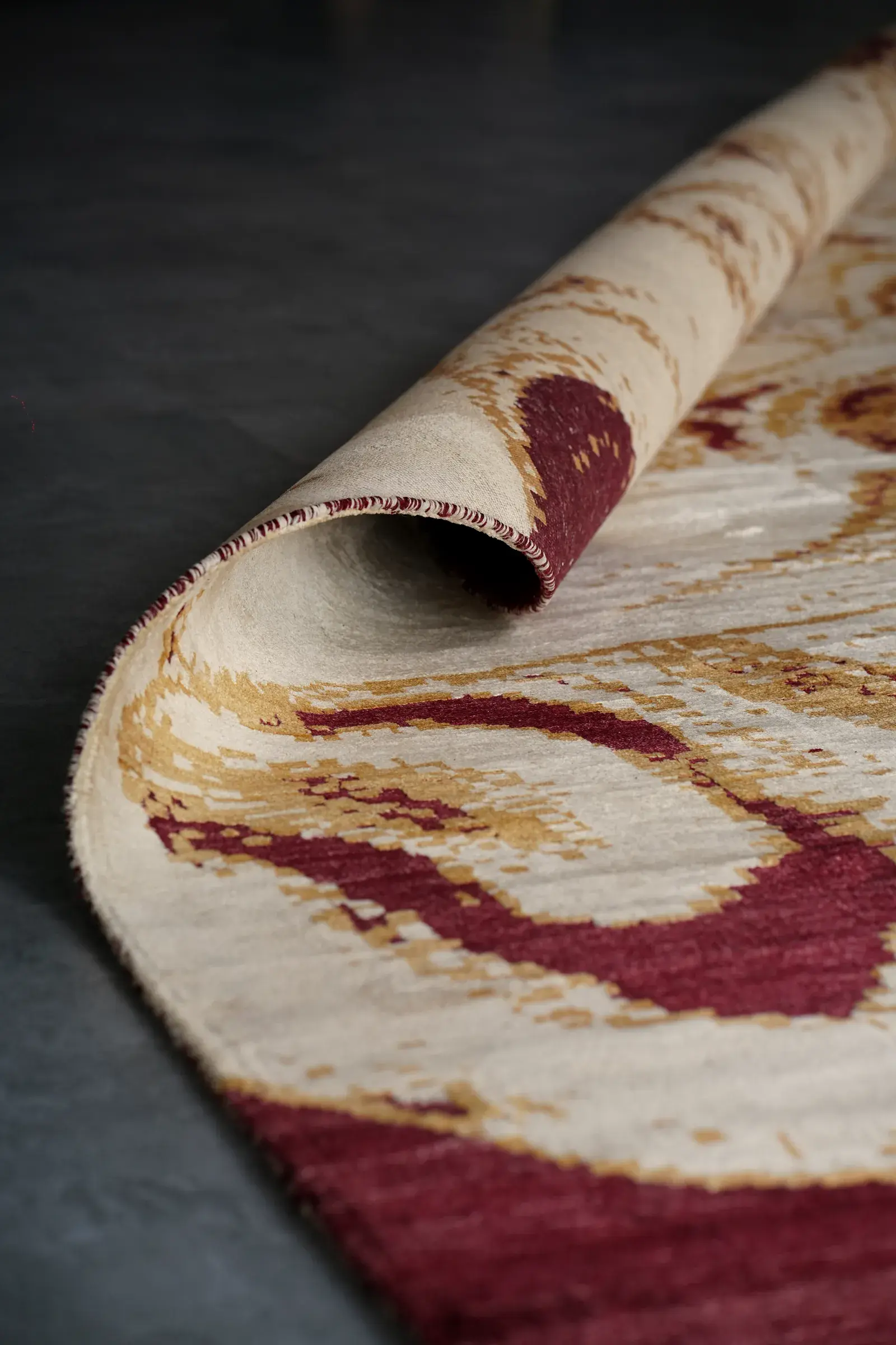 A rug rolled at one corner