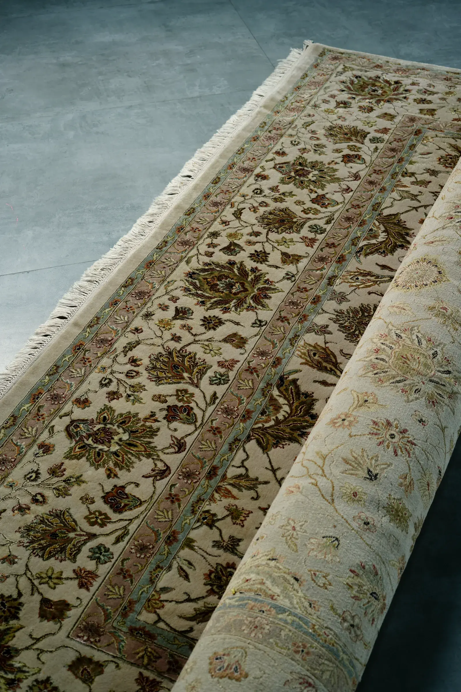 An ivory runner on a concrete floor