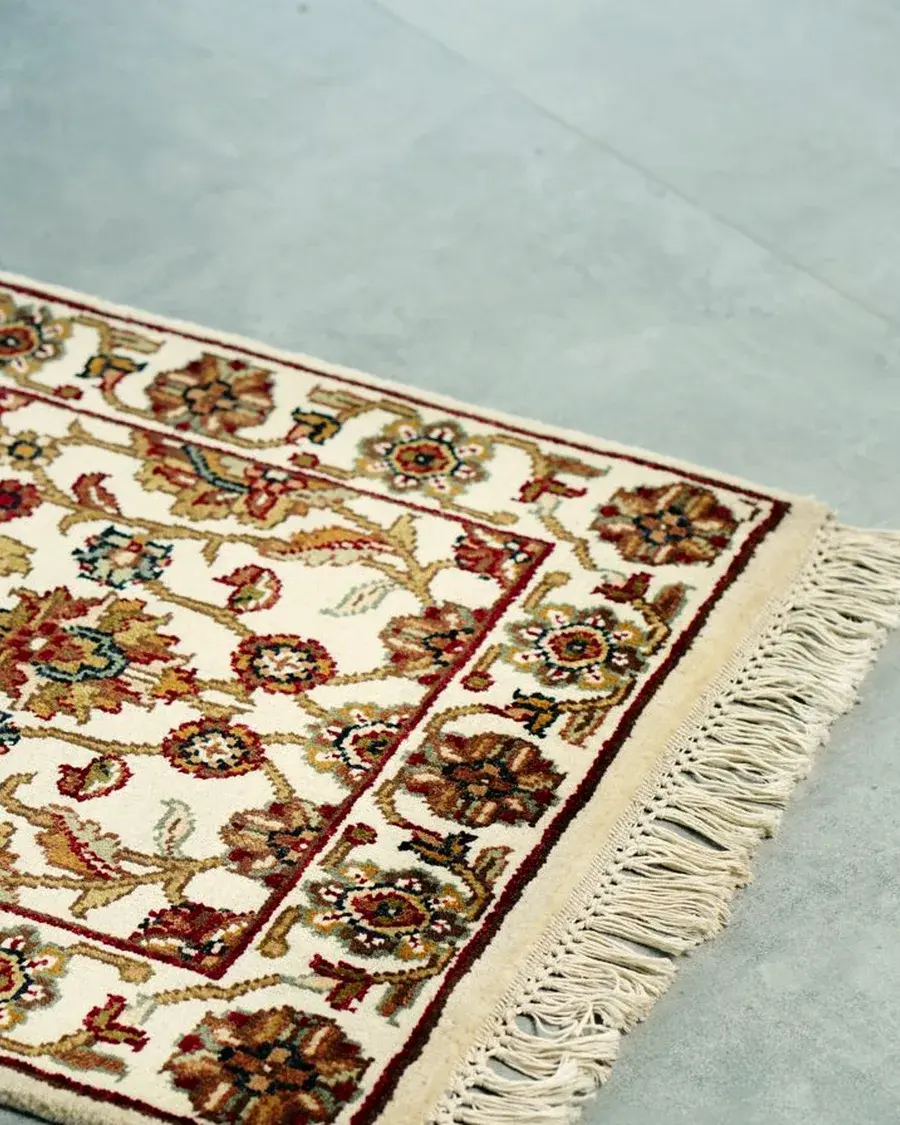 Ivory floral rug with a burgundy border