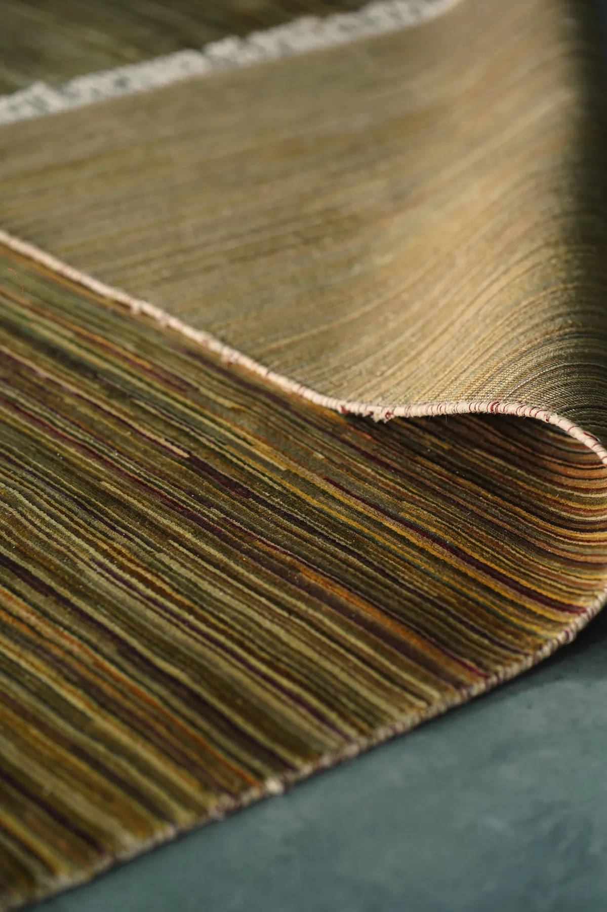The fringe of Sugandha, the warp ends left as they are