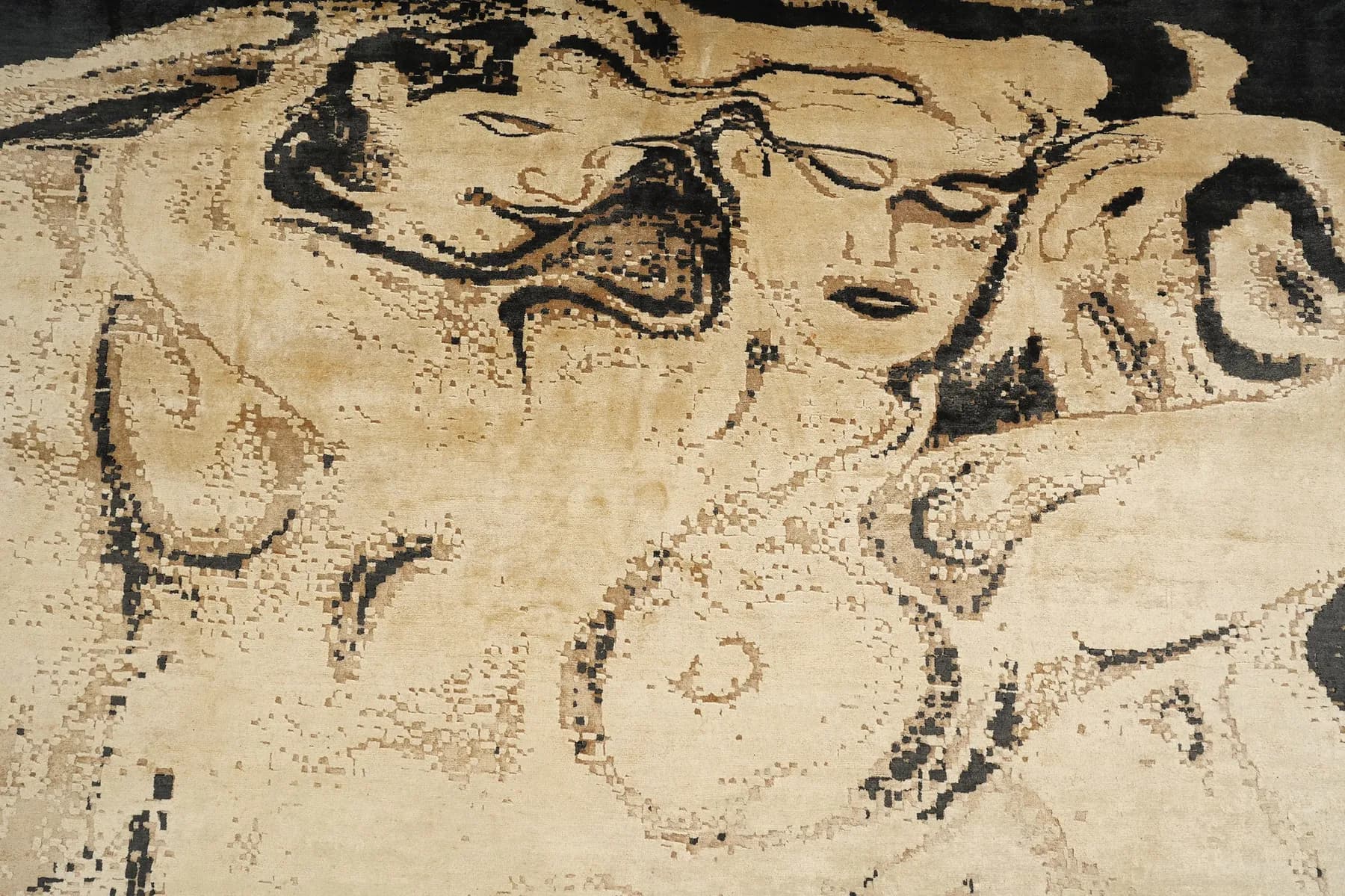 Kavya, two faces drawn in ink on an ivory Shallymar rug