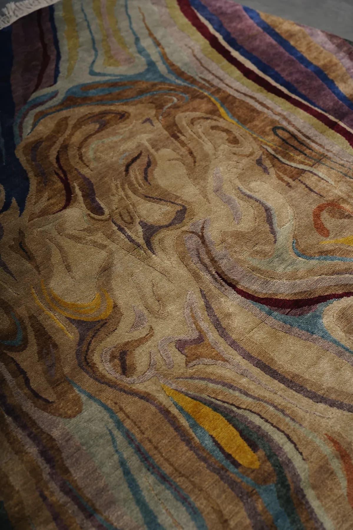 Manibhumika, a Shallymar rug in madder, indigo and sand seen close