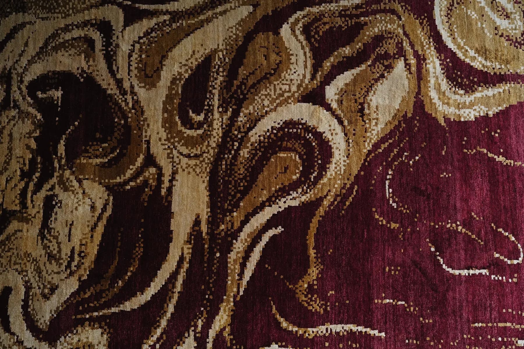 Maniraga, a burgundy and gold Shallymar rug seen close