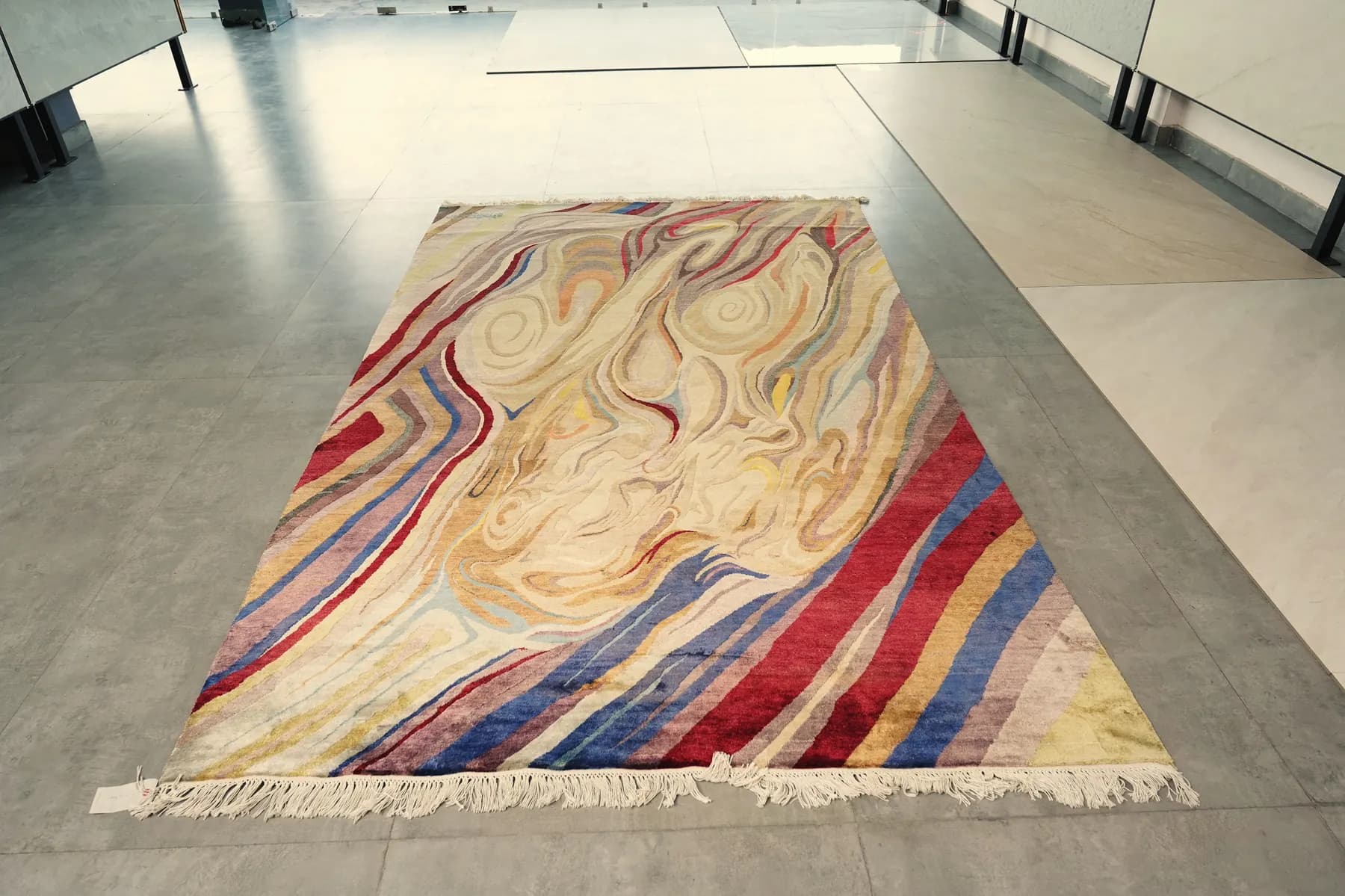 Manibhumika, a Shallymar rug in madder, indigo and sand seen close