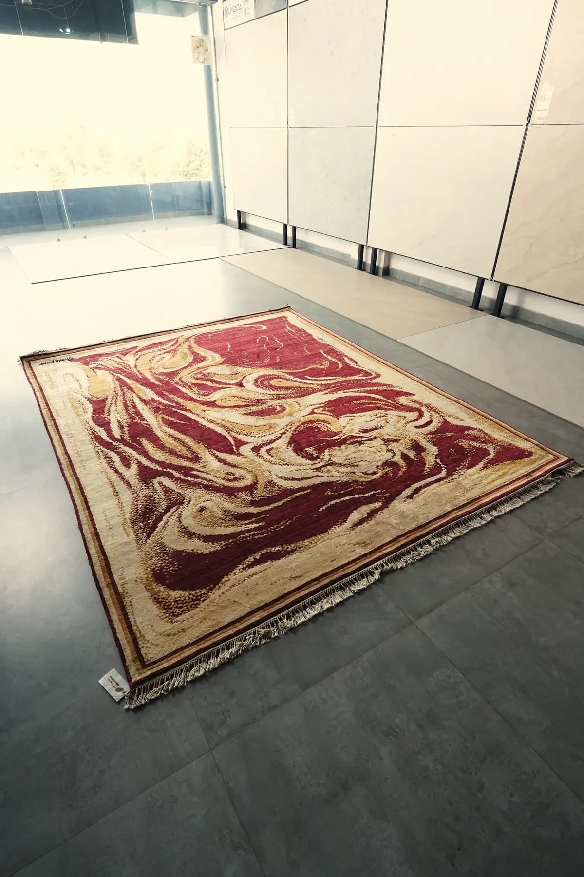 Maniraga, a burgundy and gold Shallymar rug seen close